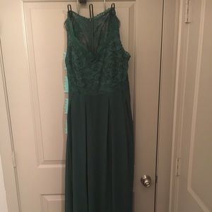 Emerald green floor length dress.